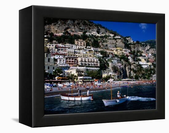 Houses Terraced into Rugged Amalfi Coastline, Boats in Foreground, Positano, Italy-Dallas Stribley-Framed Premier Image Canvas