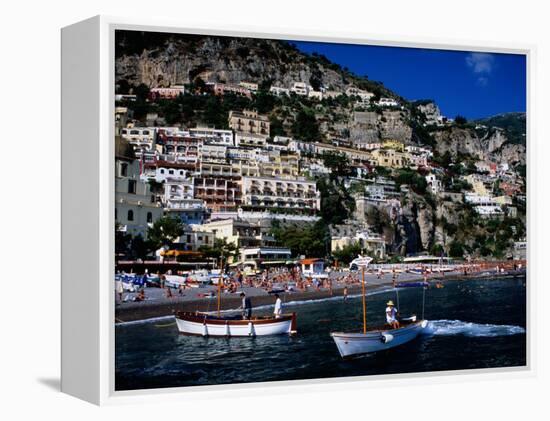 Houses Terraced into Rugged Amalfi Coastline, Boats in Foreground, Positano, Italy-Dallas Stribley-Framed Premier Image Canvas