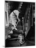 Housewife Cleaning Her Carpet with Vacuum Cleaners-Yale Joel-Mounted Photographic Print