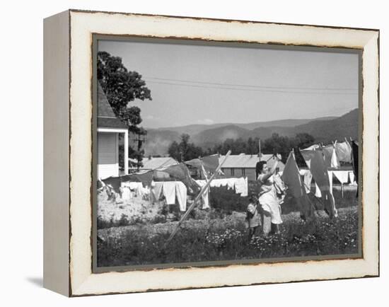 Housewife in Tygart Valley Removing Laundry from Clothesline, Her Young Daughter Stands Beside Her-Carl Mydans-Framed Premier Image Canvas