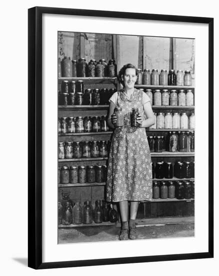 Housewife Proudly Displays Her Home Grown and Canned Food. Colorado, Sept. 1939-null-Framed Photo