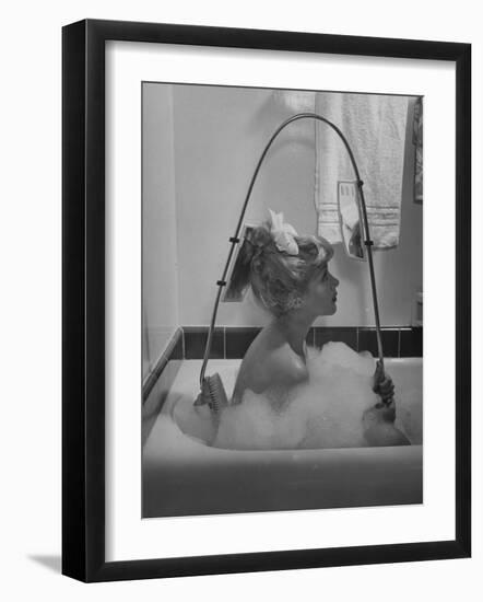 Housewife Using New Innovative Crooked Back Brush Marketed by Los Angeles Brush Manufacture, Inc-Allan Grant-Framed Photographic Print