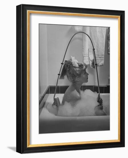 Housewife Using New Innovative Crooked Back Brush Marketed by Los Angeles Brush Manufacture, Inc-Allan Grant-Framed Photographic Print