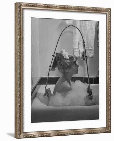 Housewife Using New Innovative Crooked Back Brush Marketed by Los Angeles Brush Manufacture, Inc-Allan Grant-Framed Photographic Print