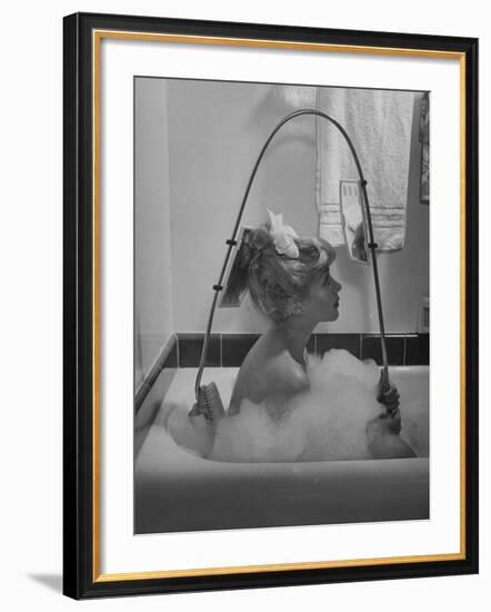 Housewife Using New Innovative Crooked Back Brush Marketed by Los Angeles Brush Manufacture, Inc-Allan Grant-Framed Photographic Print