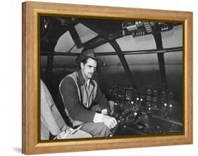 Howard Hughes Sitting at the Controls of His 200 Ton Flying Boat Called the "Spruce Goose"-J. R. Eyerman-Framed Premier Image Canvas