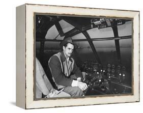 Howard Hughes Sitting at the Controls of His 200 Ton Flying Boat Called the "Spruce Goose"-J. R. Eyerman-Framed Premier Image Canvas