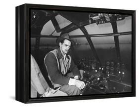 Howard Hughes Sitting at the Controls of His 200 Ton Flying Boat Called the "Spruce Goose"-J. R. Eyerman-Framed Premier Image Canvas