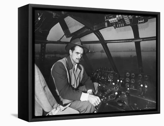 Howard Hughes Sitting at the Controls of His 200 Ton Flying Boat Called the "Spruce Goose"-J. R. Eyerman-Framed Premier Image Canvas