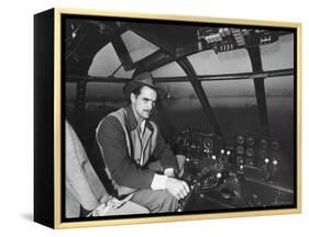 Howard Hughes Sitting at the Controls of His 200 Ton Flying Boat Called the "Spruce Goose"-J. R. Eyerman-Framed Premier Image Canvas