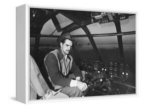 Howard Hughes Sitting at the Controls of His 200 Ton Flying Boat Called the "Spruce Goose"-J. R. Eyerman-Framed Premier Image Canvas