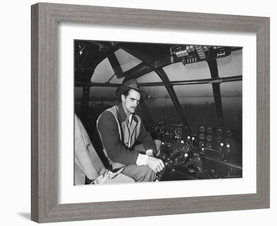 Howard Hughes Sitting at the Controls of His 200 Ton Flying Boat Called the "Spruce Goose"-J^ R^ Eyerman-Framed Premium Photographic Print