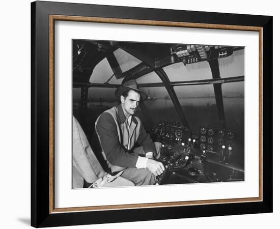 Howard Hughes Sitting at the Controls of His 200 Ton Flying Boat Called the "Spruce Goose"-J^ R^ Eyerman-Framed Premium Photographic Print