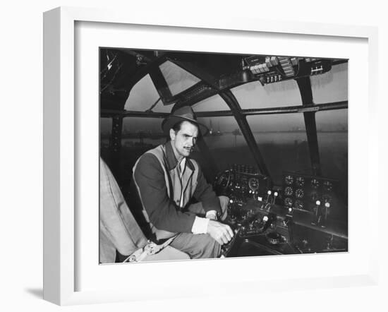 Howard Hughes Sitting at the Controls of His 200 Ton Flying Boat Called the "Spruce Goose"-J^ R^ Eyerman-Framed Premium Photographic Print