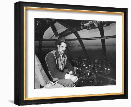 Howard Hughes Sitting at the Controls of His 200 Ton Flying Boat Called the "Spruce Goose"-J^ R^ Eyerman-Framed Premium Photographic Print