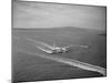 Howard Hughes' Spruce Goose Taxiing across Water-null-Mounted Photographic Print