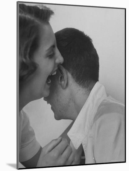 HS Senior Judy Krug Laughs Into Friend's Ear shows Why She Was Considered Most Talkative in School-Gordon Parks-Mounted Photographic Print