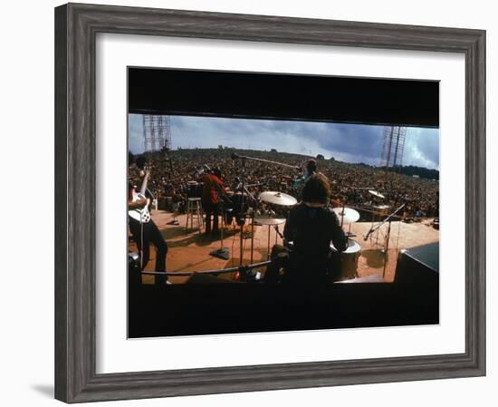 Huge Crowd Listening to a Band Onstage at the Woodstock Music and Art Festival-Bill Eppridge-Framed Photographic Print