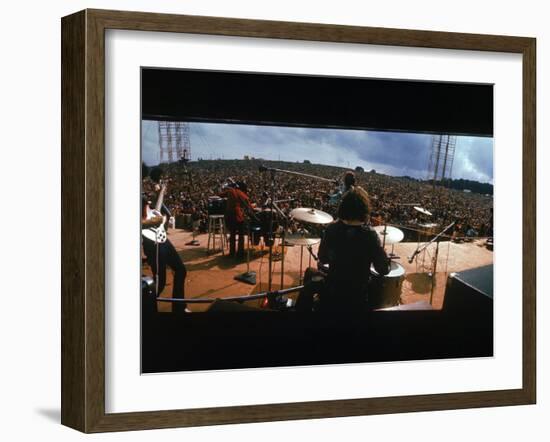 Huge Crowd Listening to a Band Onstage at the Woodstock Music and Art Festival-Bill Eppridge-Framed Photographic Print