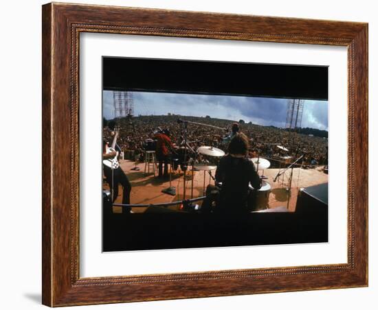 Huge Crowd Listening to a Band Onstage at the Woodstock Music and Art Festival-Bill Eppridge-Framed Photographic Print