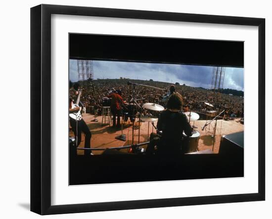 Huge Crowd Listening to a Band Onstage at the Woodstock Music and Art Festival-Bill Eppridge-Framed Photographic Print