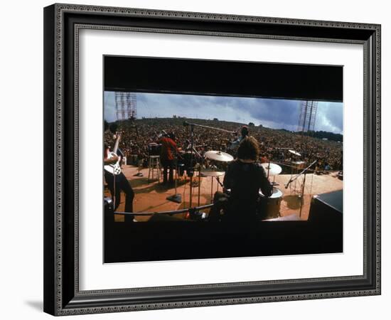 Huge Crowd Listening to a Band Onstage at the Woodstock Music and Art Festival-Bill Eppridge-Framed Photographic Print