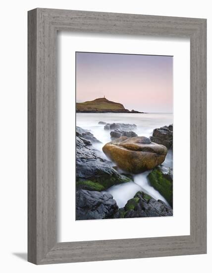 Huge granite boulder lodged on the shores of Porth Ledden at dawn, Cornwall, England. Spring (April-Adam Burton-Framed Photographic Print