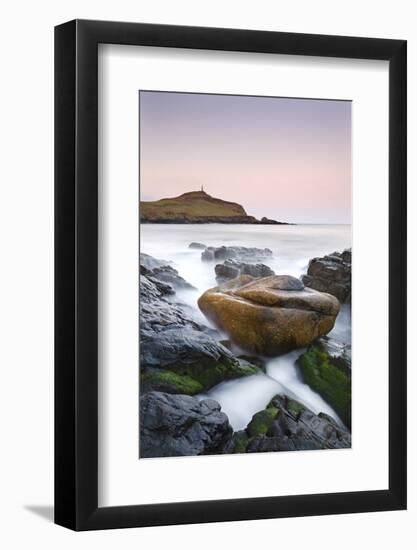 Huge granite boulder lodged on the shores of Porth Ledden at dawn, Cornwall, England. Spring (April-Adam Burton-Framed Photographic Print