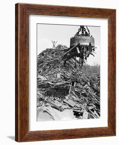 Huge Magnet Picking up Scrap Metal-null-Framed Photographic Print