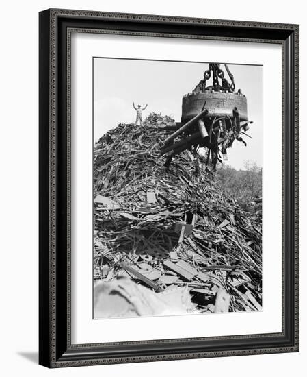 Huge Magnet Picking up Scrap Metal-null-Framed Photographic Print