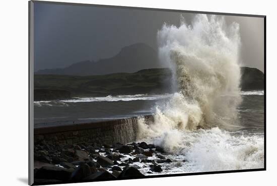 Huge Waves Crash Against a Stone Jetty at Criccieth, Gwynedd, Wales, United Kingdom, Europe-Graham Lawrence-Mounted Photographic Print