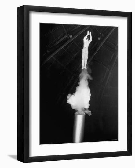 Human Cannonball Egle Zacchini Emerging From Barrel of Cannon During Her Circus Act-Cornell Capa-Framed Photographic Print