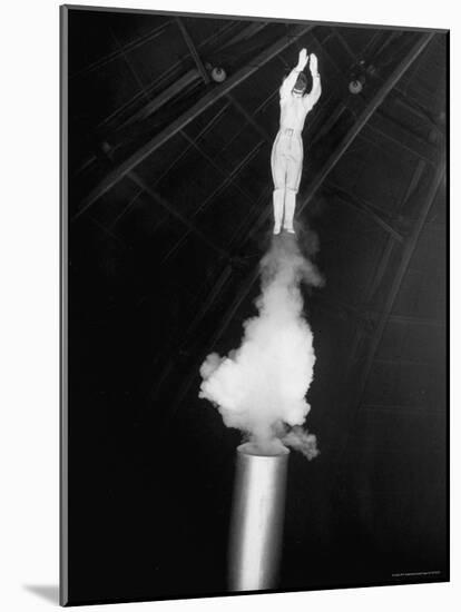 Human Cannonball Egle Zacchini Emerging From Barrel of Cannon During Her Circus Act-Cornell Capa-Mounted Photographic Print