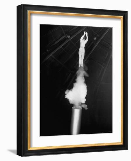 Human Cannonball Egle Zacchini Emerging From Barrel of Cannon During Her Circus Act-Cornell Capa-Framed Photographic Print