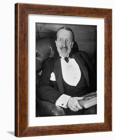 Hungarian Prince George Festetics Clad in Tuxedo While Sitting in Chair at Festetics Castle-Margaret Bourke-White-Framed Photographic Print