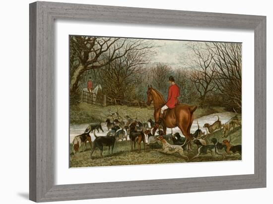 Huntsman with Foxhounds Tracking a Scent Across a Brook, England, 1800s-null-Framed Giclee Print