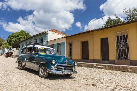 Photographic Print: A vintage 1950's American car working as a taxi in the town of Trinidad, UNESCO World Heritage Site by Michael Nolan: 36x24in