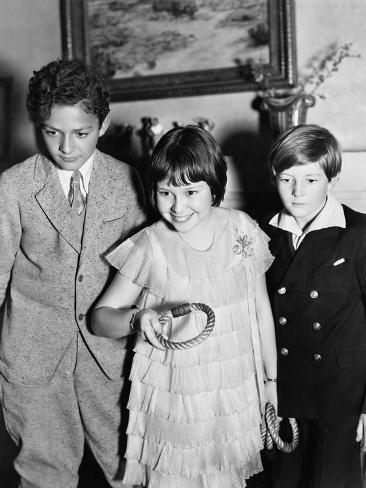 Photo: Three Children Standing Together Playing a Game: 24x18in