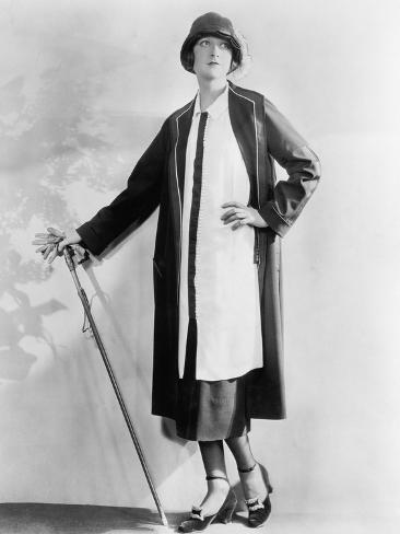 Photo: Woman with a Walking Stick in an Elegant Dress and Coat: 24x18in