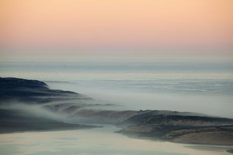 Premium Photographic Print: USA, California, Moro Bay. Morning fog on sand dunes and ocean. by Jaynes Gallery: 36x24in