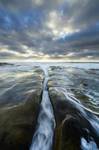 Premium Photographic Print: USA, California, La Jolla. Wave flows through cracked sandstone. by Jaynes Gallery: 36x24in