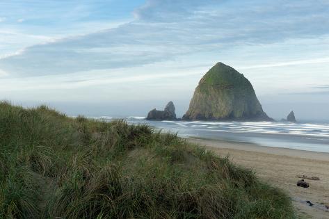 Premium Photographic Print: Hay Stack Rock on the sandy beach at Cannon Beach, Oregon by Greg Probst: 36x24in