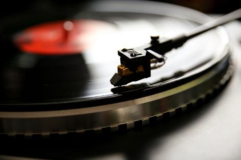 Photographic Print: Close up View of Old Fashioned Turntable Playing a Track from Black Vinyl. by graphicphoto: 24x16in