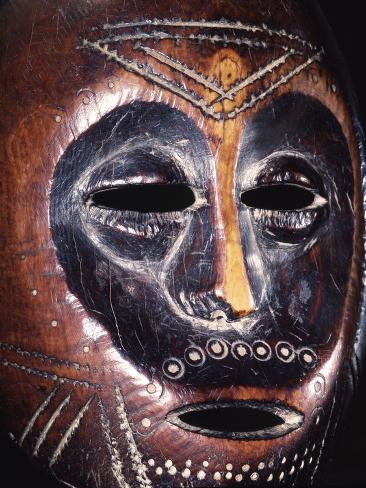 Photographic Print: Ivory Lega mask, eastern DR Congo, 19th-20th century by Werner Forman: 12x9in