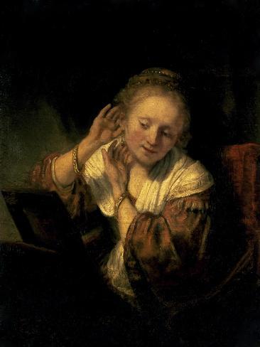 Art Print: Young Woman Trying Earrings, 1654 by Rembrandt van Rijn: 12x9in