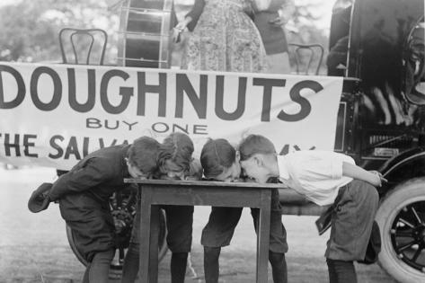 Art Print: Boys Chow Down on a Table in a Donut Eating Contest: 18x12in