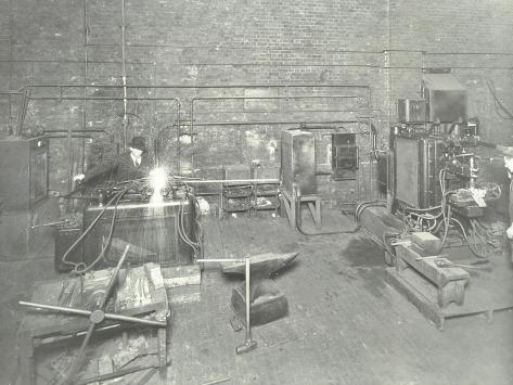 Photographic Print: Men Welding, Charlton Central Repair Depot, London, 1932: 12x9in