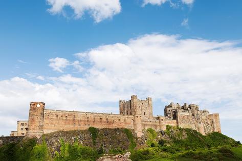 Photographic Print: Bamburgh Castle, a fortress constructed on top of a craggy outcrop of volcanic dolerite by Stuart Forster: 12x8in