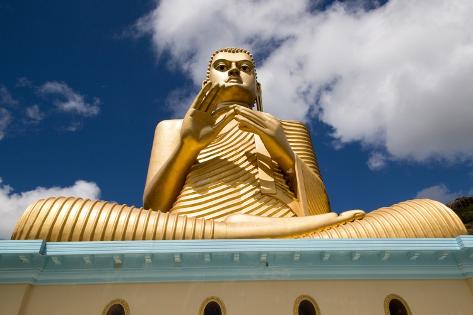 Photographic Print: Giant Golden Buddha statue at Dambulla cave temple complex, UNESCO World Heritage Site, Sri Lanka by Ian Murray: 12x8in