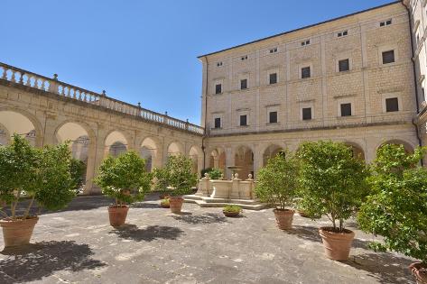 Photo: Interior terrace of a castle with flowers and a fountain. Tuscany, Italy: 12x8in